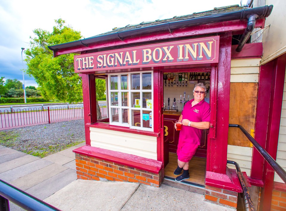 Pub landlord Alan Cowood pictured in the entrance of The Signal Box Inn