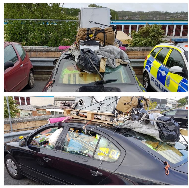 Police arrested a 'total plank' driving with his car crammed full of rubbish and even more strapped to the roof