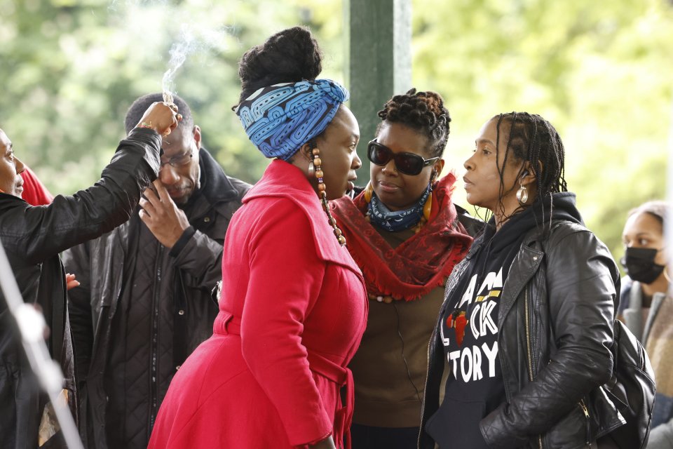 People gather at a vigil for the shot Black Lives matter activist