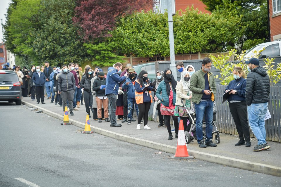 Bolton locals queuing to visit the town's vaccination bus