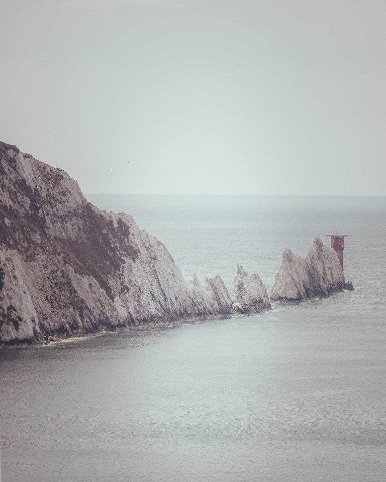 The vertical chalk stacks of the Needles are a result of heavy folding of chalk which results in hard chalk, resistant to erosion