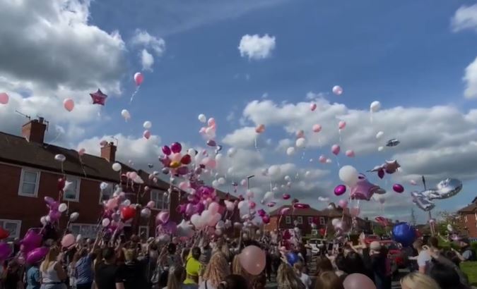 Hundreds paid tribute to the toddler at a vigil on Thursday