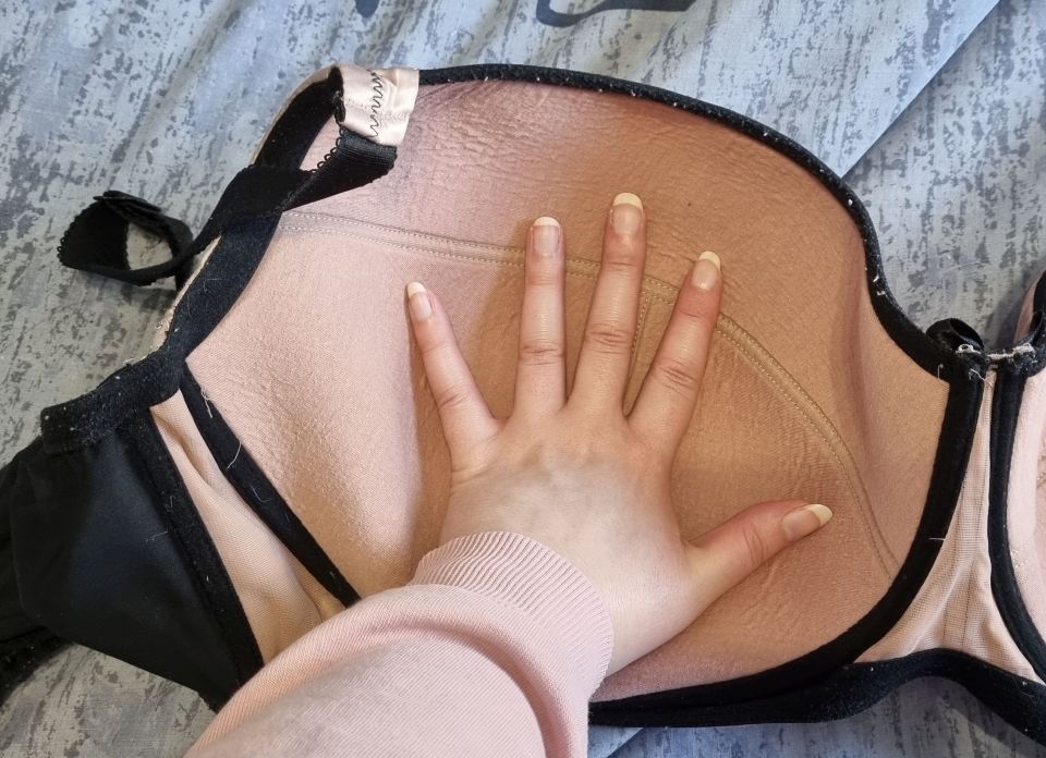 Laura's bra compared to her hand size