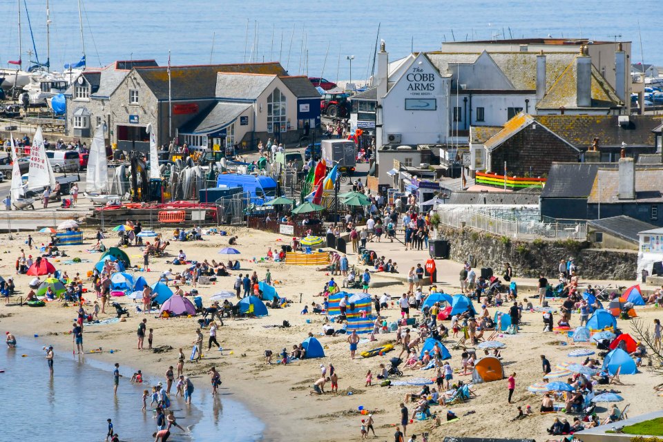 A busy beach in Lyme Regis, Dorset