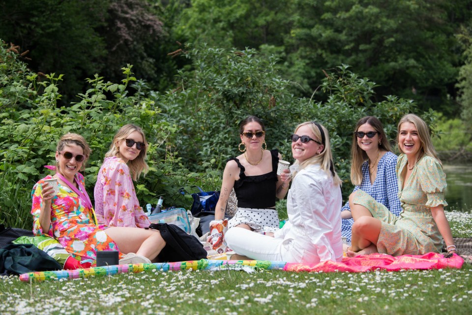 Ladies enjoying an al fresco day in the sunshine in Victoria Park, east London