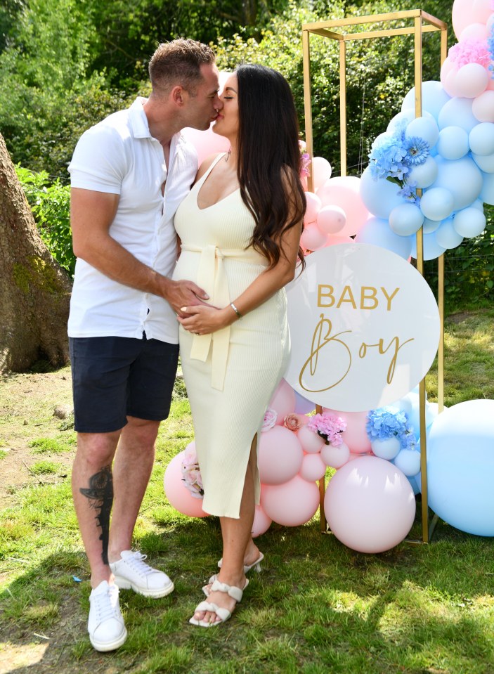 The couple shared a kiss as the news was revealed