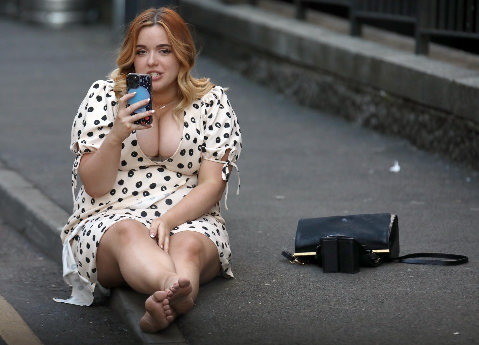 One woman was pictured sitting bare foot on a pavement in Leeds