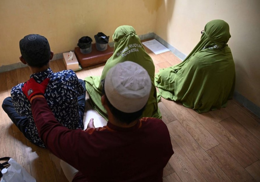 A cleric performing an exorcism on members of the LGBT community in Jakarta, Indonesia