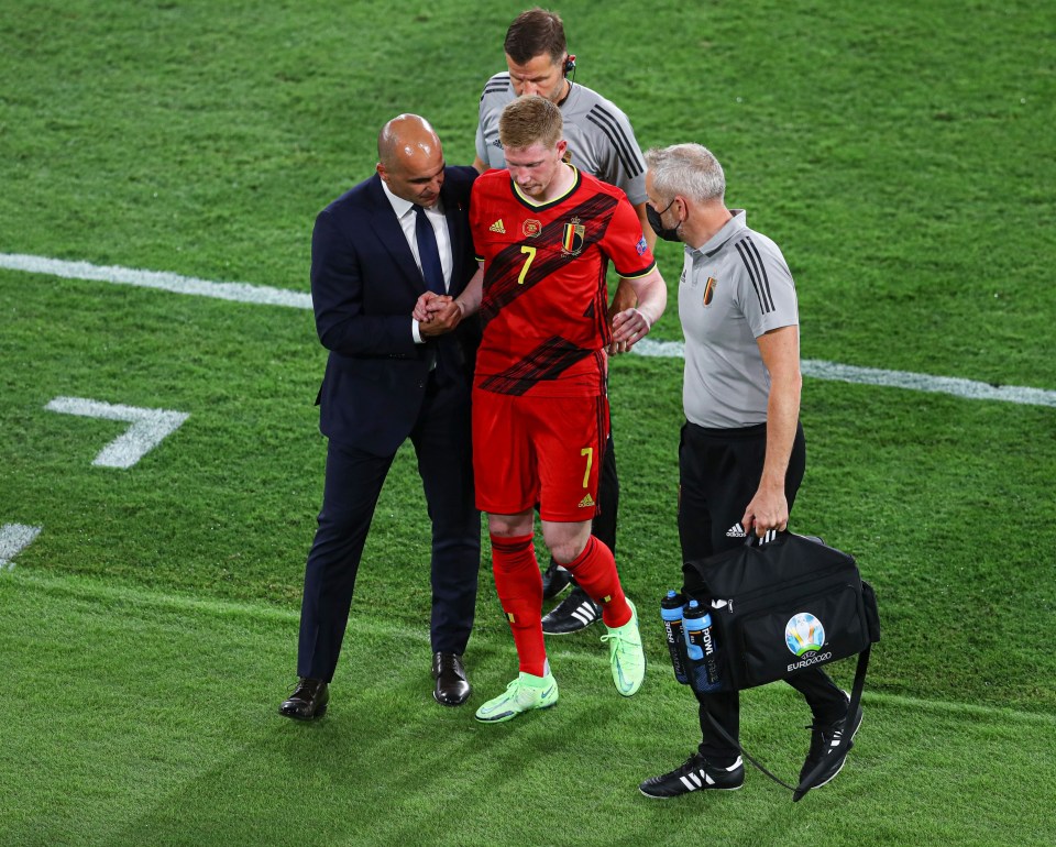 Belgium boss Roberto Martinez had to help his star man off the pitch