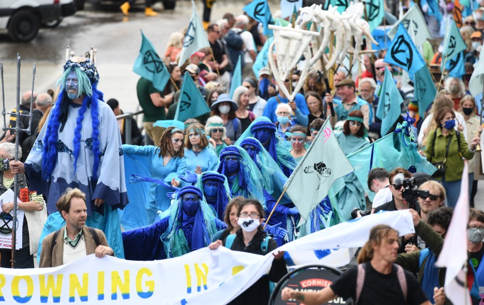 The environmental protestors marched through the streets of St Ives in Cornwall