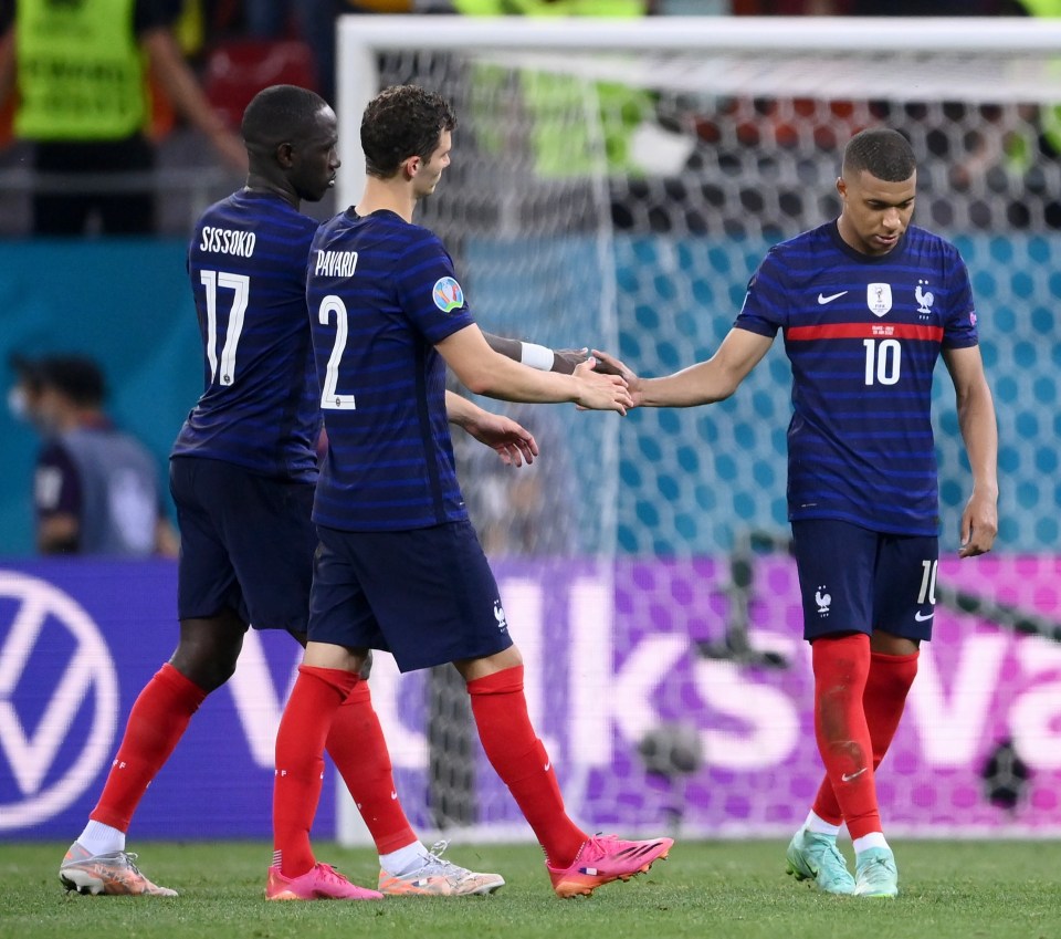 Moussa Sissoko and Benjamin Pavard tried to console their team-mate on the pitch