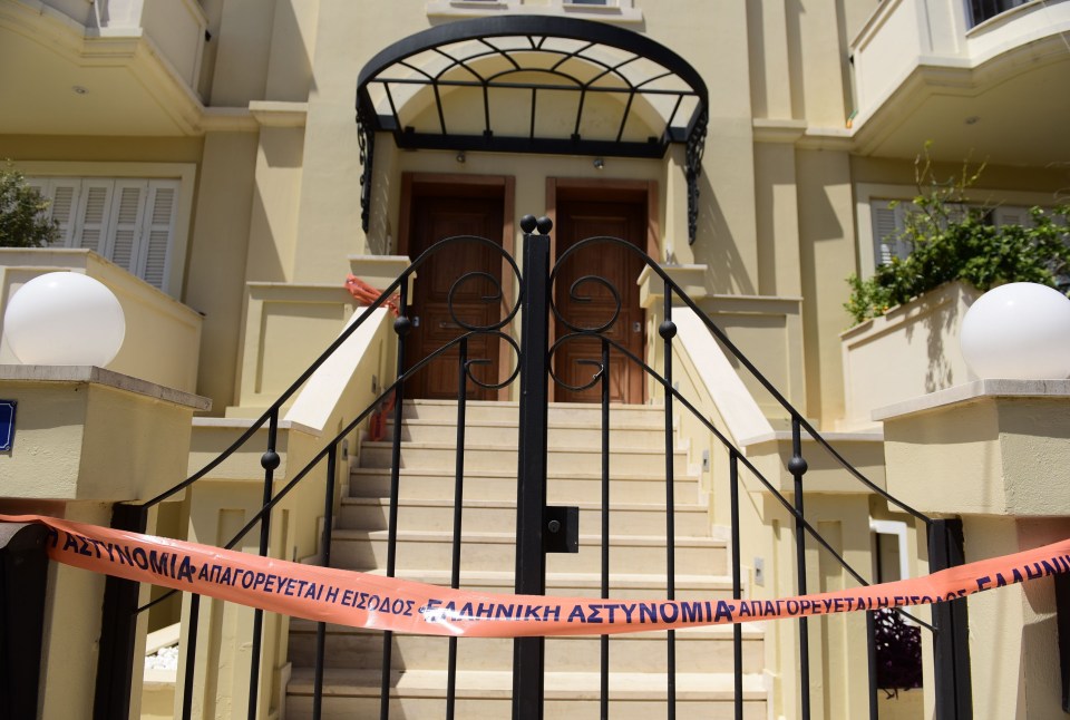 Police tape outside their maisonette home in Greece