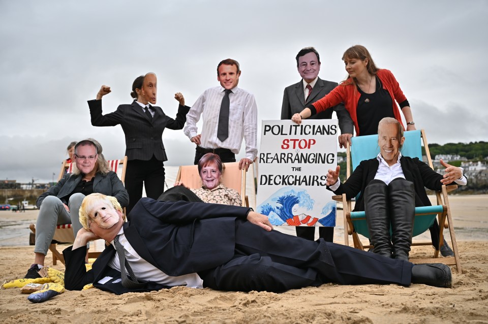 Protestors gathered on the beach dressed up as world leaders