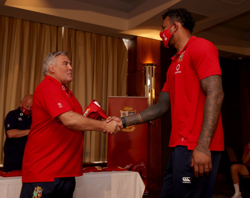 Courtney Lawes receives his British & Irish Lions jersey from Jason Leonard