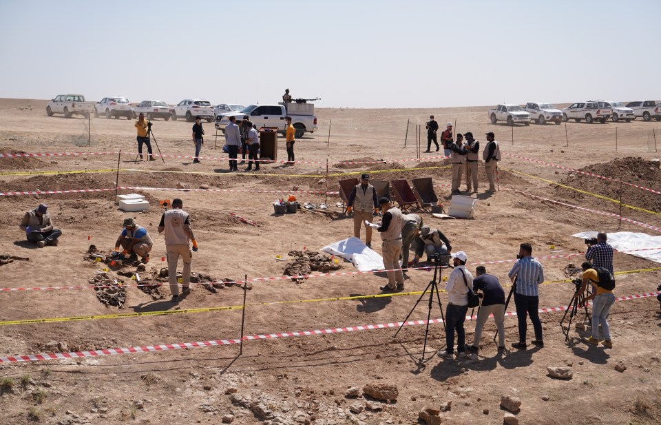 Experts unearth the mass grave and remove the victims for identification