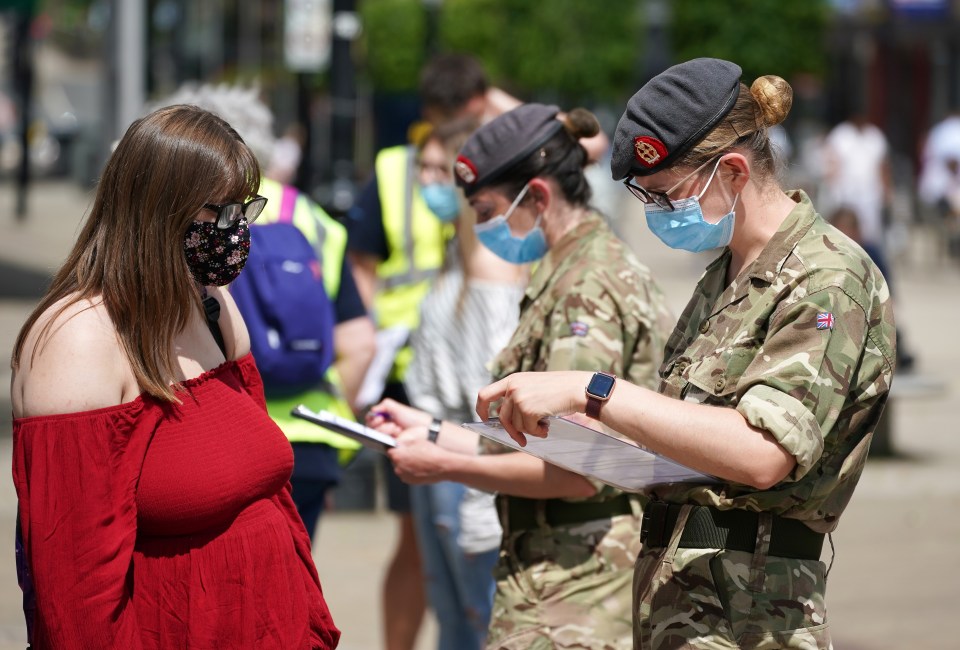 The R rate in parts of England is as high as 2.5 due to the Delta variant first seen in India, a leading expert warned. Pictured: A pop up vaccination centre in Bolton, a Delta variant hotspot