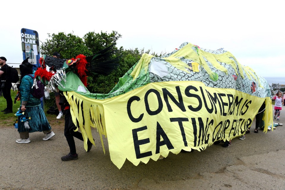 Protestors carry an eye-catching banner as part of the demo