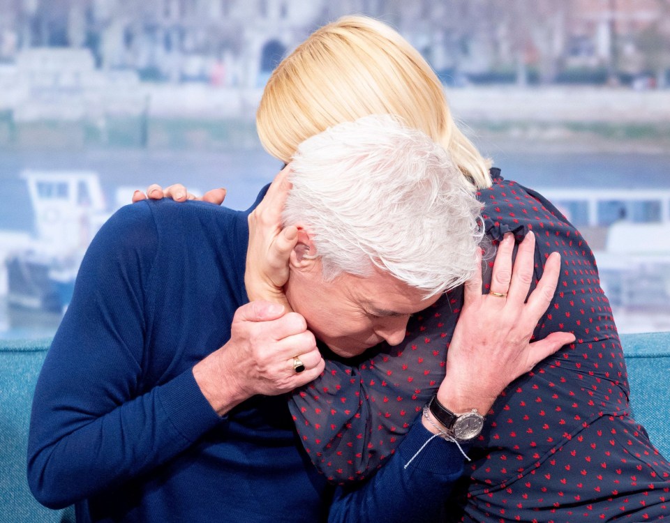 Phillip, 59, says Holly, 40, supported him all the way through, before tearfully revealing he was gay on air last February