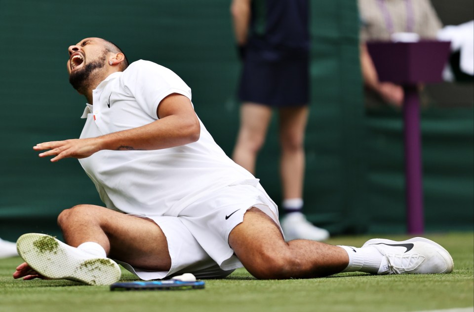 Kyrgios helped in agony as he crashed to the turf following a slip while changing direction