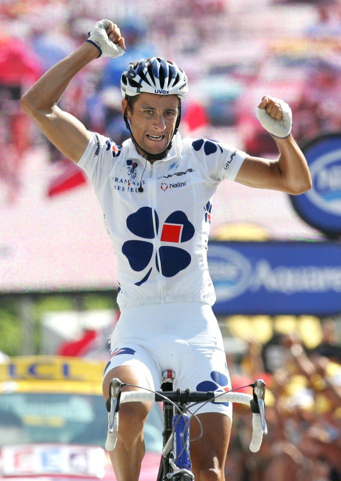 Sandy Casar road to victory after a dog sent him flying off his bike