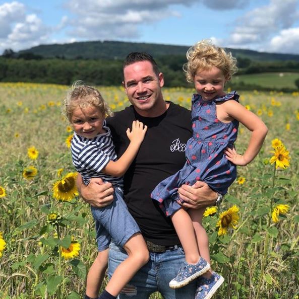 Kieran Hayler smiles for a snap with his kids Bunny and Jett