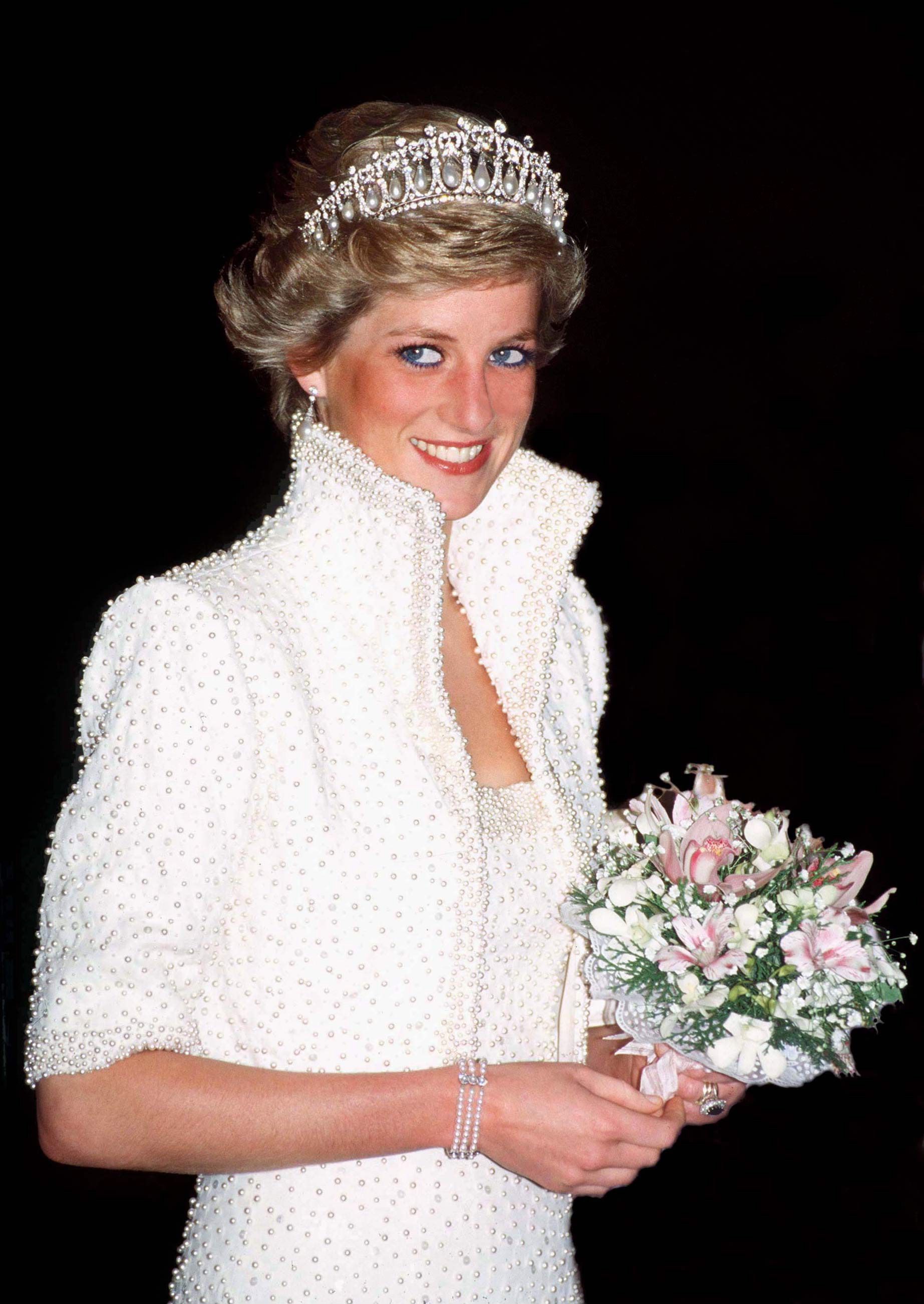 The elegant accessory worn on her wrist - by designer Nigel Milne - once belonged to Diana, who was seen wearing it on numerous occasions