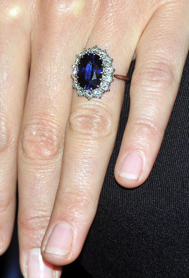 It features a sapphire and diamonds