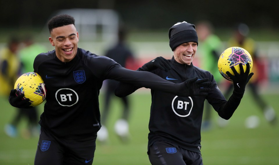 Foden and Greenwood share a joke in England training