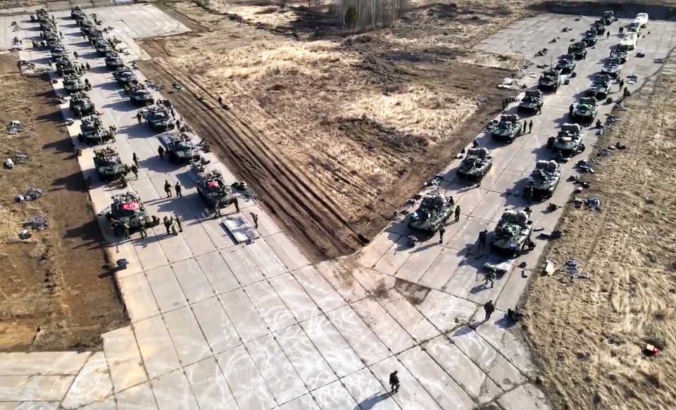 Russian military vehicles move during drills in Crimea in April