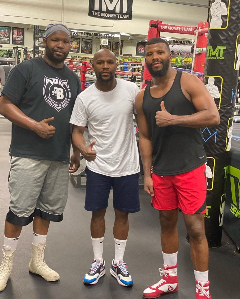 Floyd Mayweather pictured with Badou Jack, right