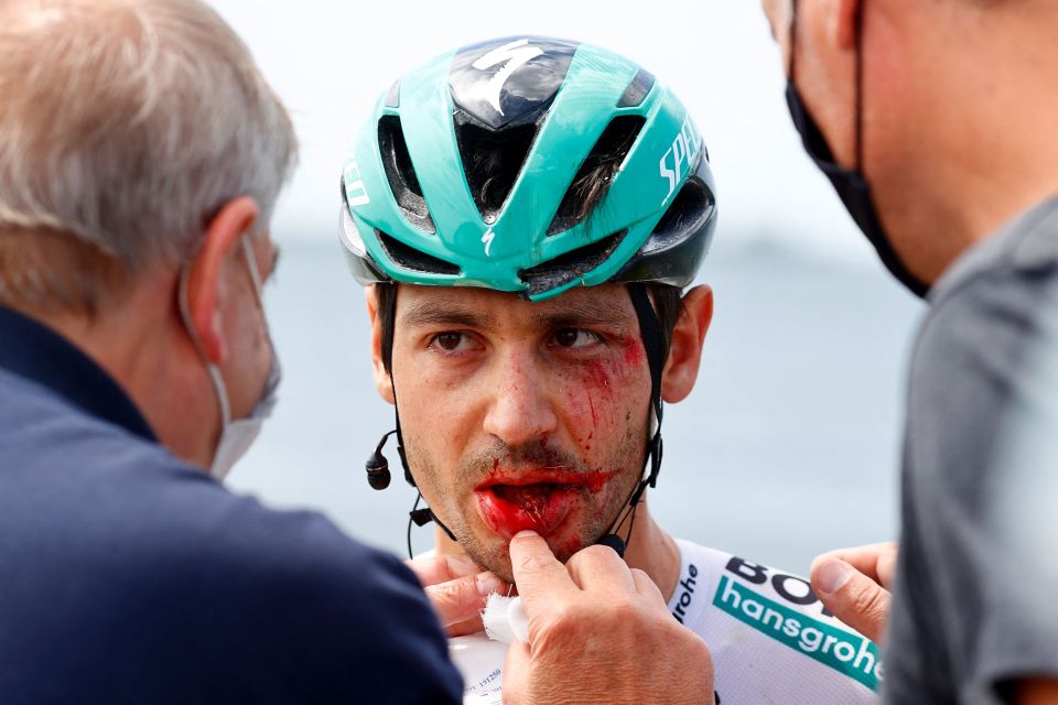 Germany's Emanuel Buchmann is examined after being involved in a massive pack crash during the 15th stage of the Giro