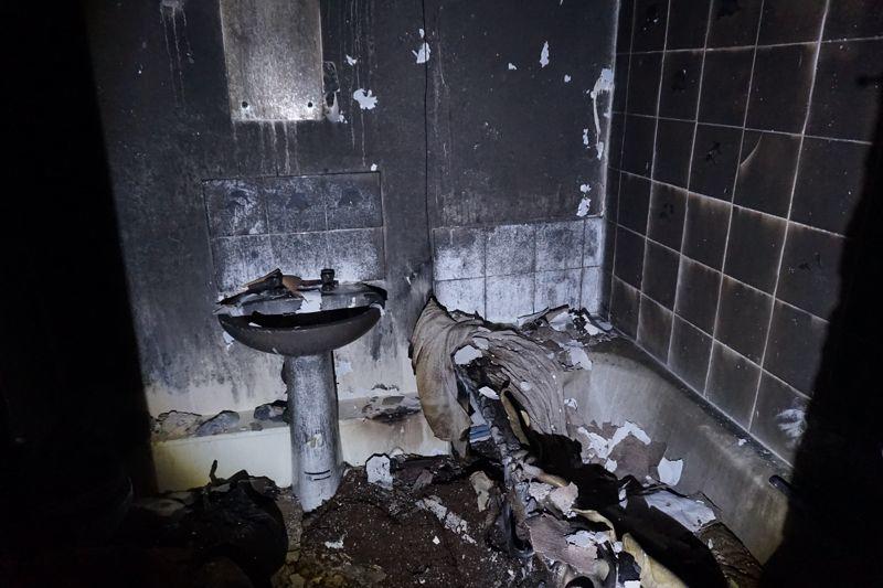 The bathroom was completely black and the bath had melted away in the fire