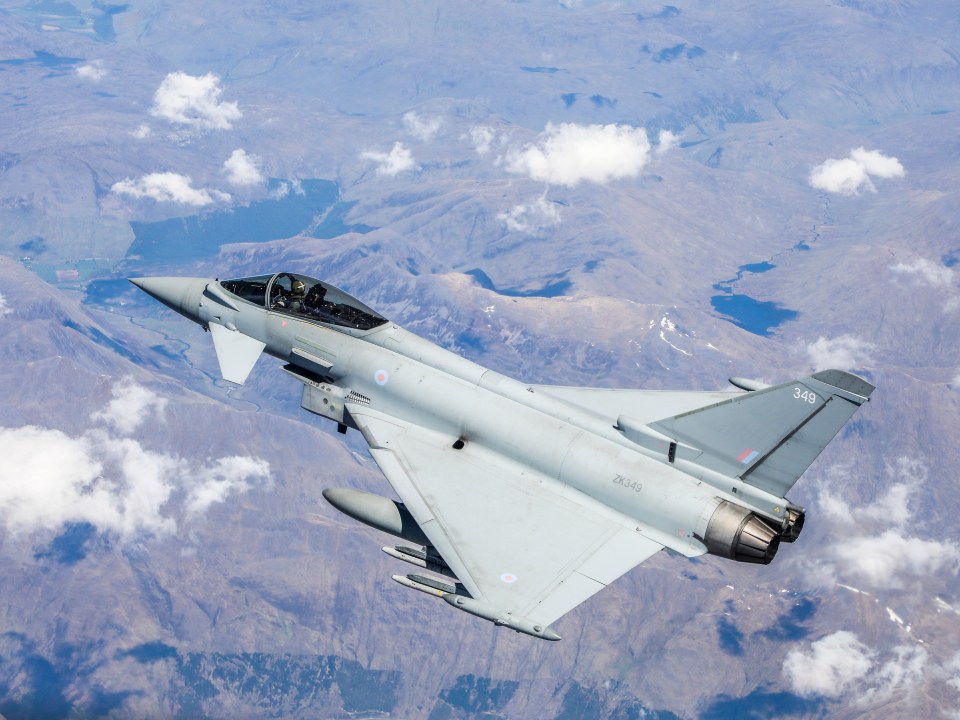 The spectacular footage shows an RAF Typhoon taking to the skies over the UK to escort the US aircraft