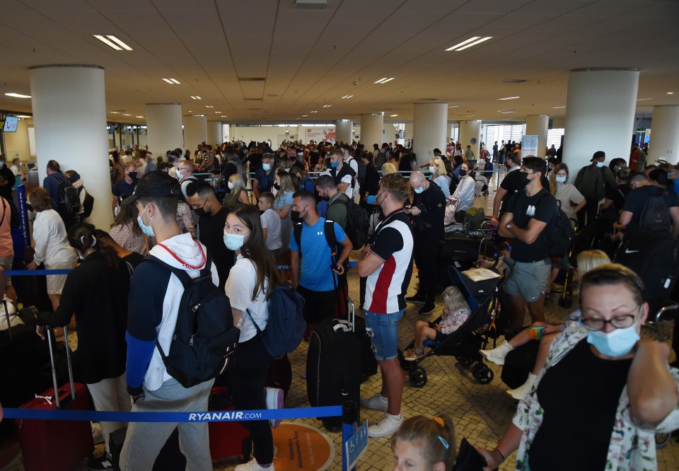 Faro airport departures lounge in Portugal as people rush back to the UK