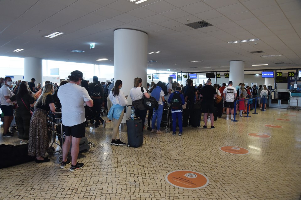 Huge queues were seen as holidaymakers waited patiently to jet back to the UK