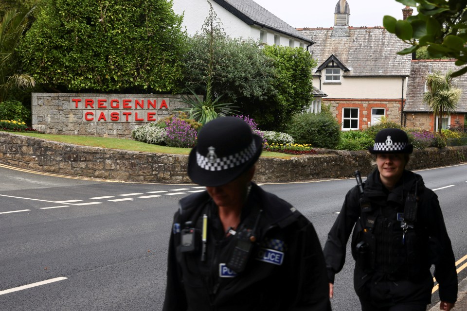 Police officers walk past Tregenna Castle