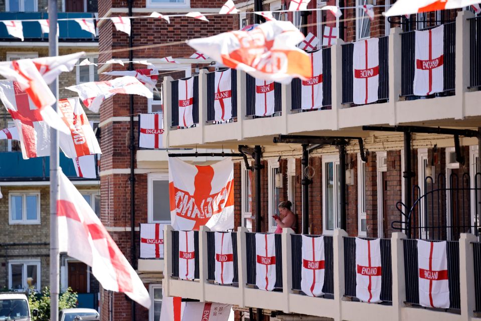 Flags hang from balconies and along walkways at the Kirby Estate in Bermondsey