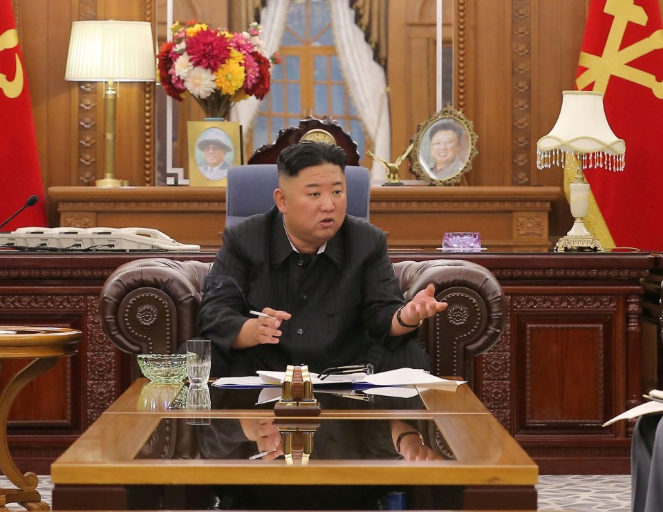 Kim Jong Un looking slim at a meeting in Pyongyang in a photo released on June 8