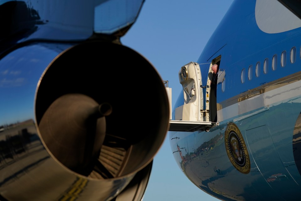 The door to Air Force One is opened as President Joe Biden arrives at RAF Mildenhall