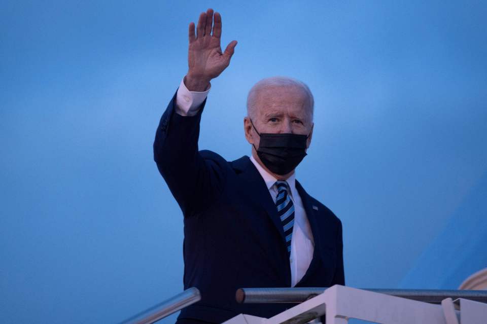 Biden waves before boarding Air Force One from Mildenhall