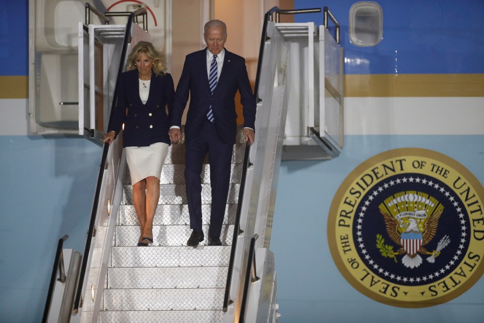 US President Joe Biden and first lady Jill Biden disembark Air Force One upon arrival at Cornwall Airport Newquay