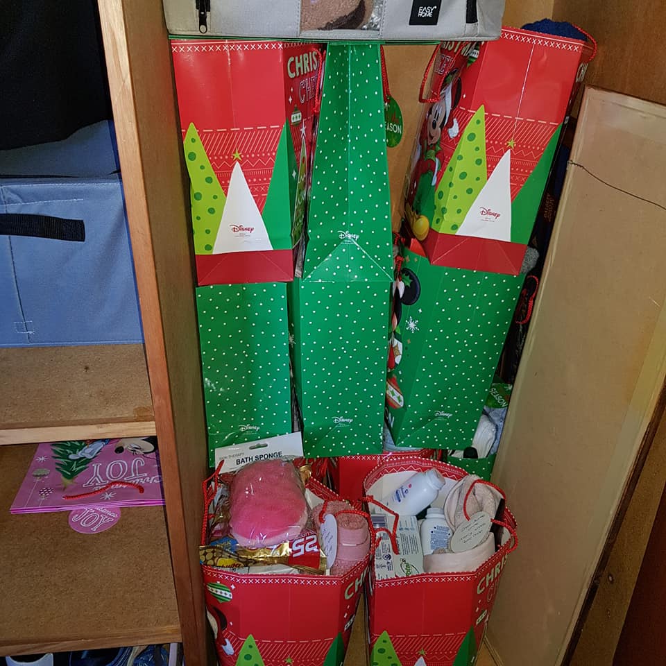 Her cupboards are chock-a-block full with gift bags and presents