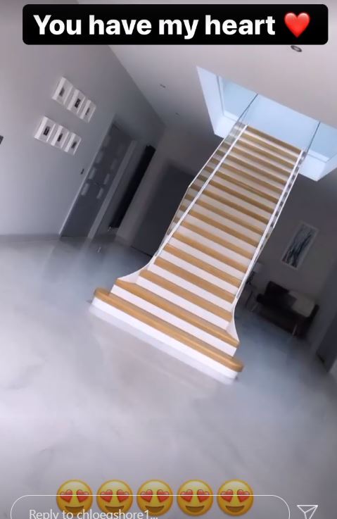 The staircase sits in the middle of the hallway