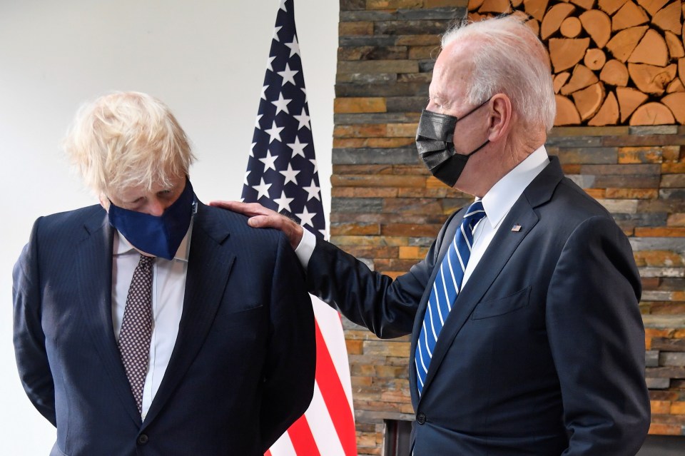 Joe Biden puts a comforting hand on the PM's shoulder