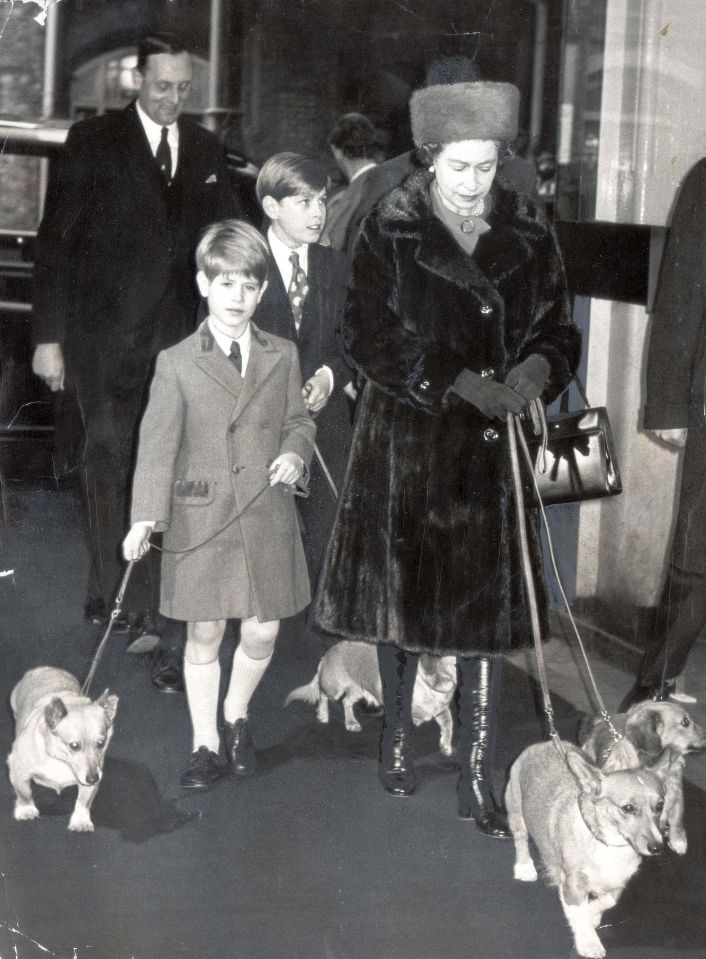 Black and white photos from the archives show him looking after the Queen's corgis, while with his mother and brother Andrew at Liverpool Street Train Station in 1971