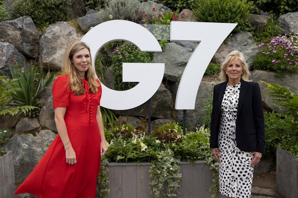 Carrie Symonds and Jill Biden pose for a picture as their husbands attend the G7 summit