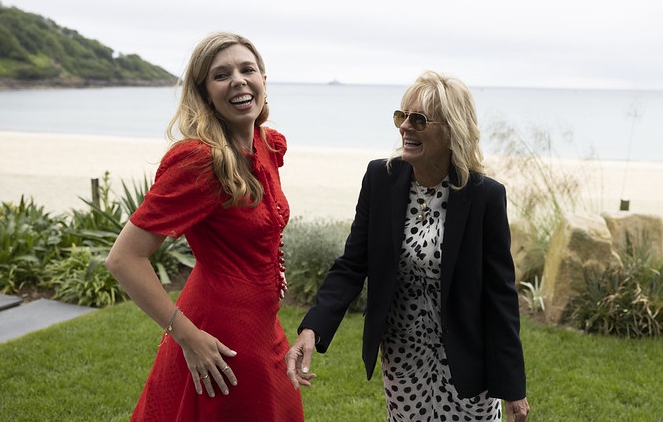 Smiling Carrie and Jill share a laugh as they talk while at the G7 summit