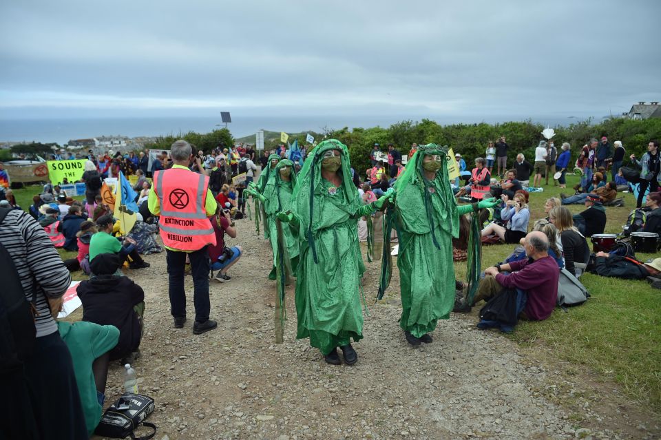 Other demonstrators got dressed up in green robes to make their point