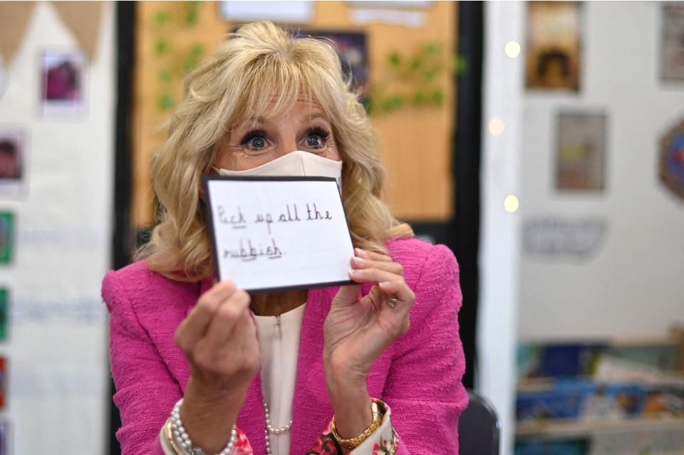 Mrs Biden smiled behind her face mask as she taught pupils today