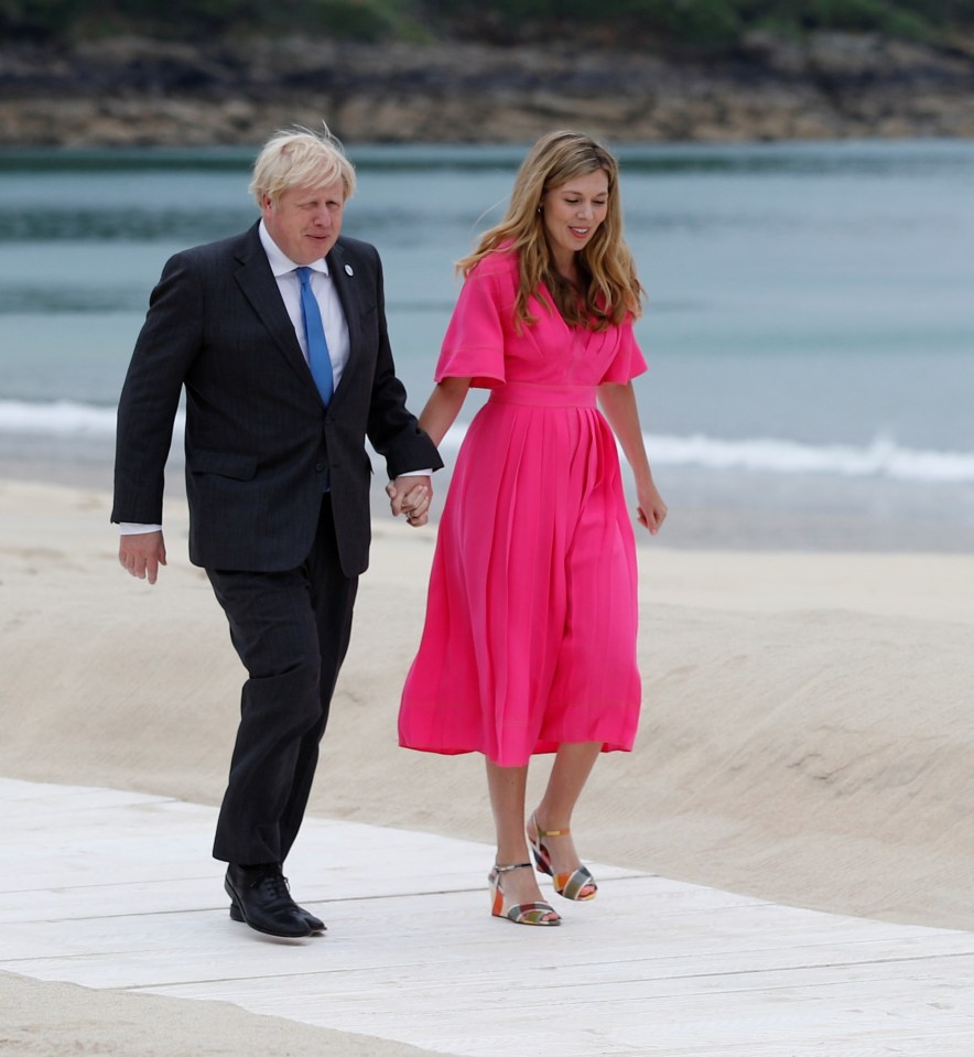 The PM and the new Mrs Johnson head to the beach at Carbis Bay to greet world leaders